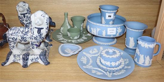 A collection of thirteen pieces of green and pale blue Wedgwood jasper pottery and a pair of ceramic dogs